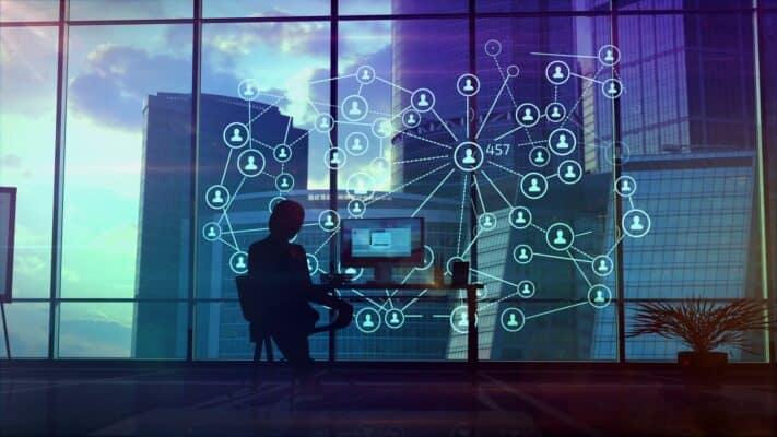 Digital network with connected users and data in a modern office environment.